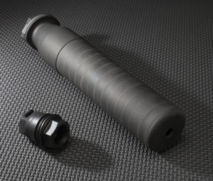 Suppressor with the adapter required to hold it on a rifle
